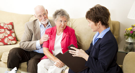 elderly couple taking some advise from the health advisor