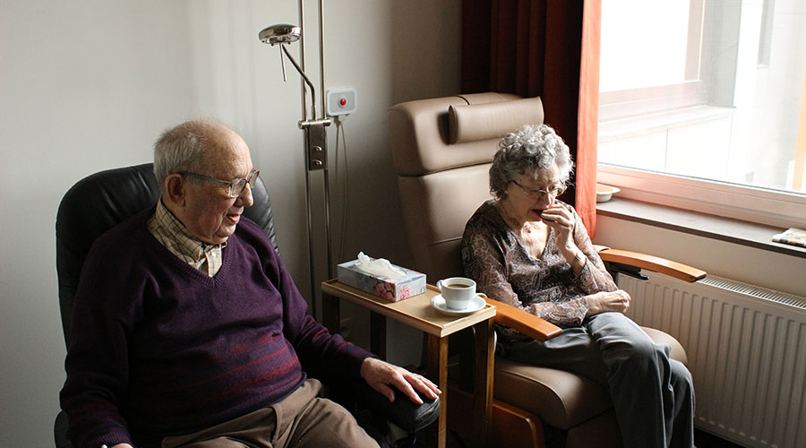 elderly couple leaving together in a nursing home facility
