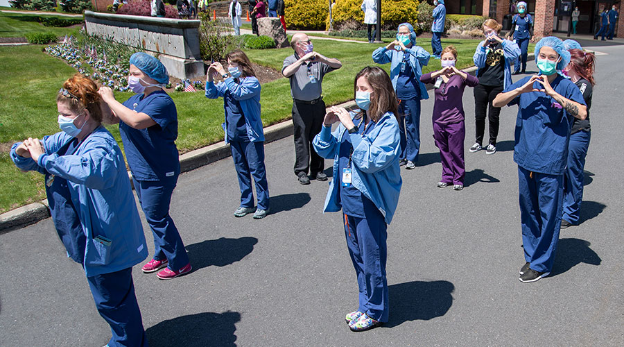 a group of seniors and caregivers get together