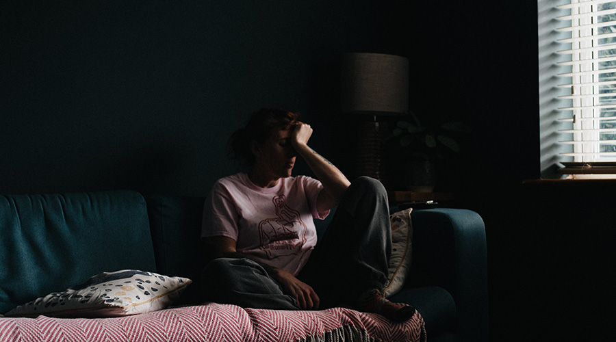 caregiver sitting alone in a room