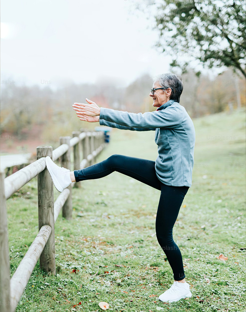 photo of an elderly woman doing balance exercise