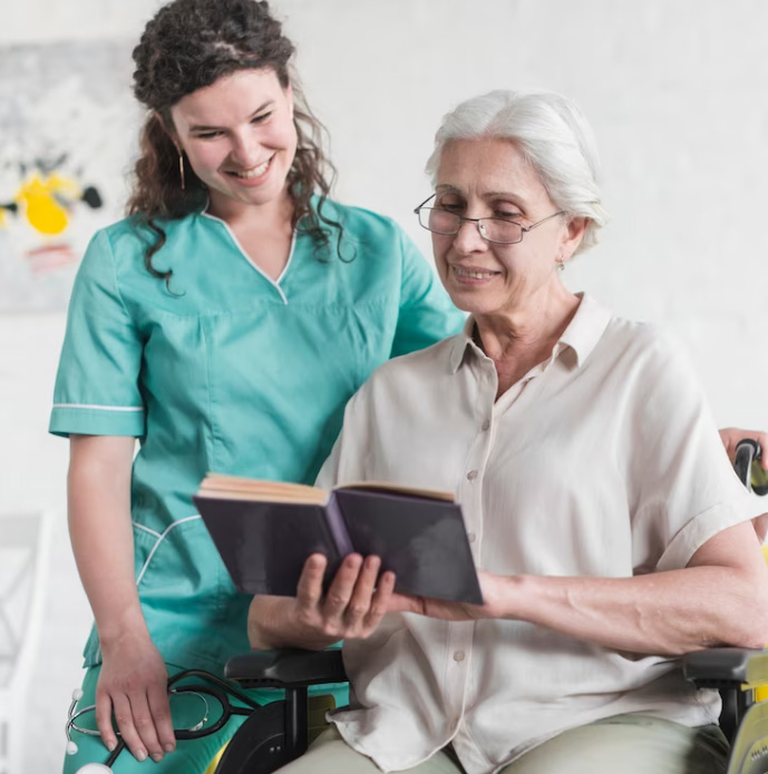 caregiver-and-elderly-reading-book