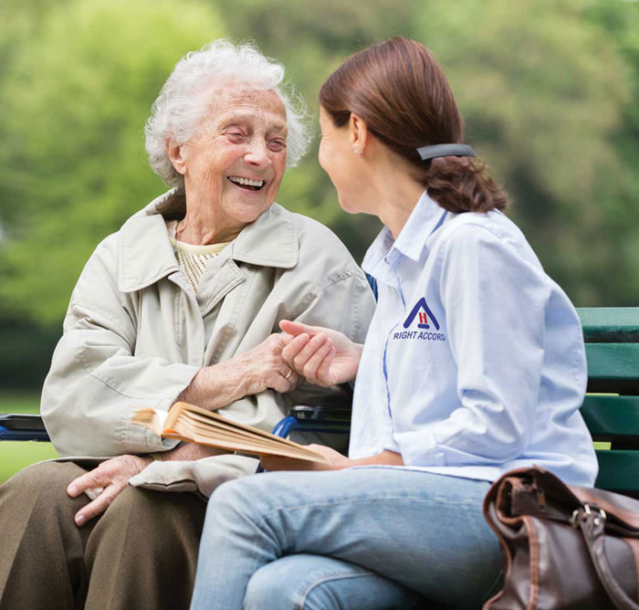 caregiver assisting an elderly
