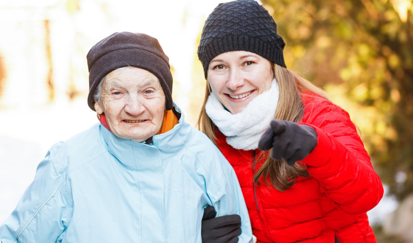 happy caregiver with the elderly