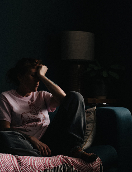 caregiver sitting alone in a room