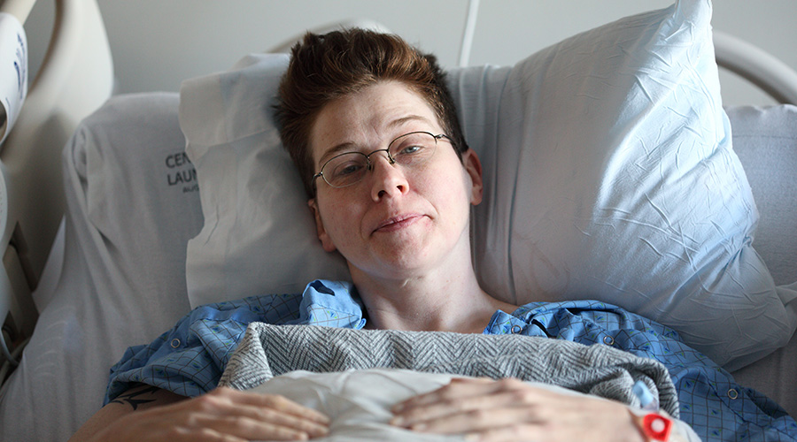 female patient lying in the hospital bed