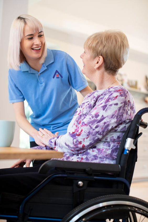 caregiver helping elderly in a wheelchair
