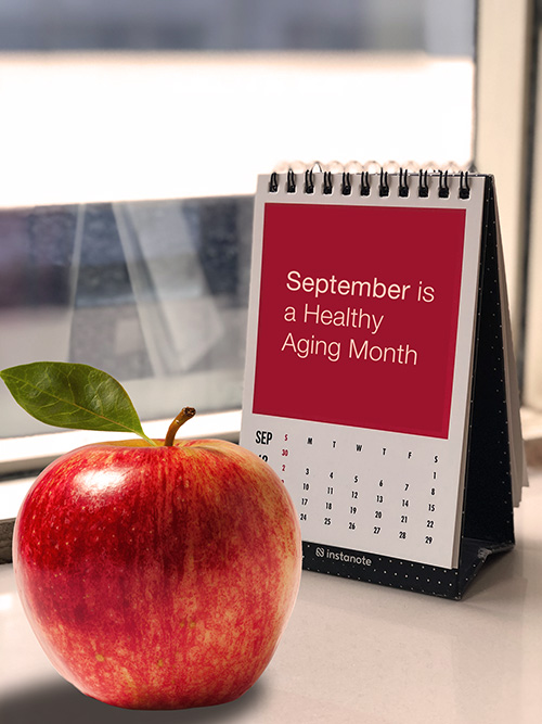 a picture of an apple in front of the calendar desk
