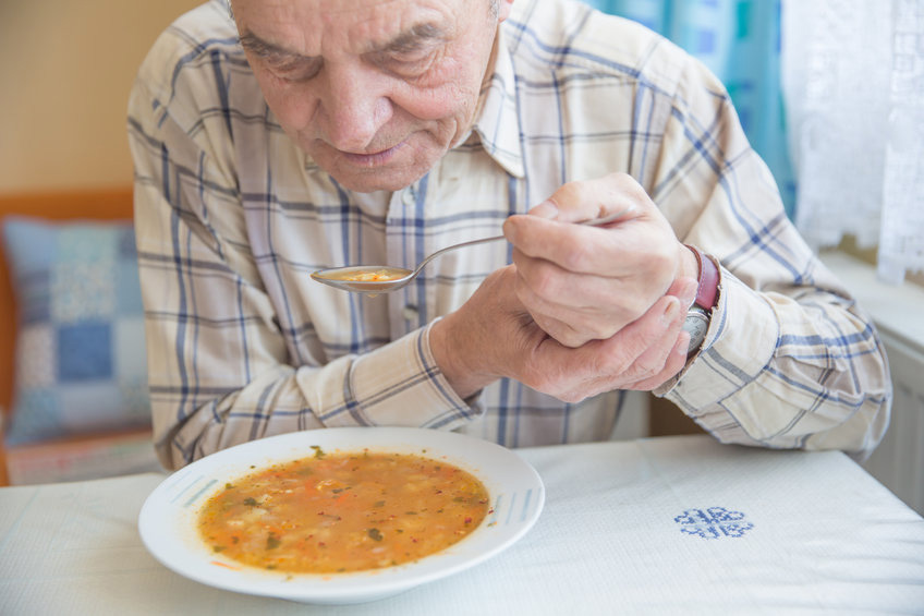 elderly with Parkinson's Disease having difficulty eating
