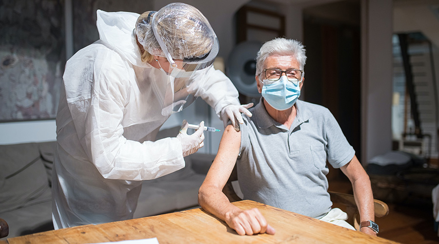 senior man getting vaccine