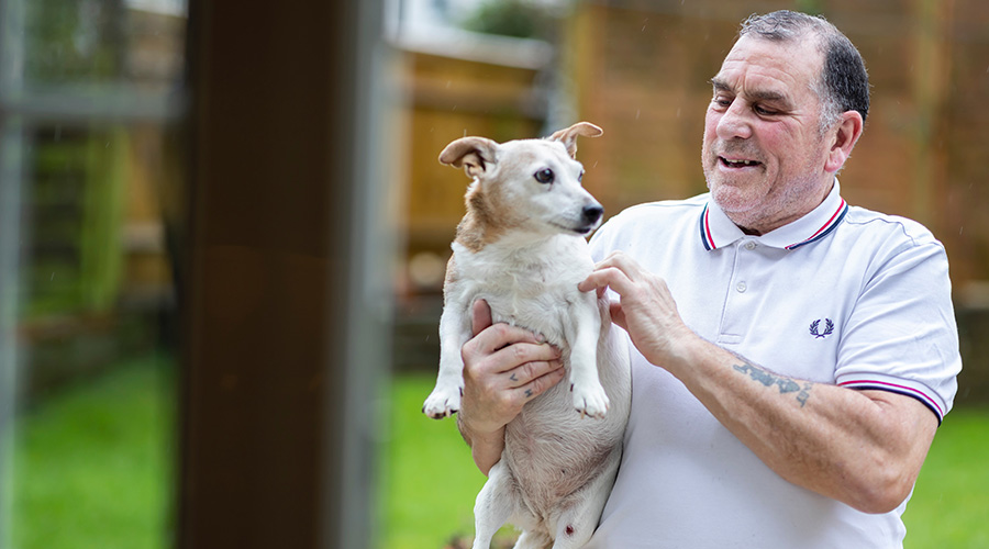 elderly man with his pet dog