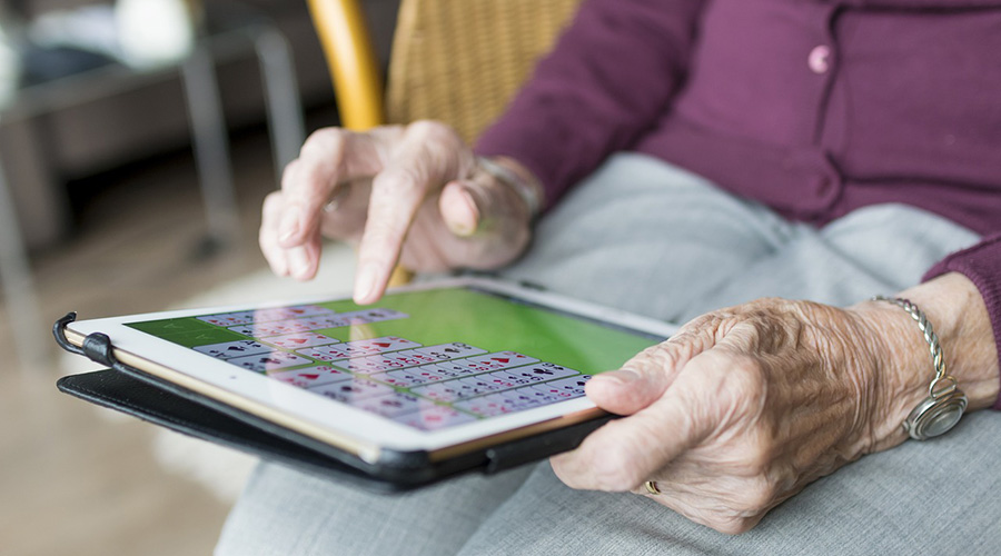 elderly person using gadget