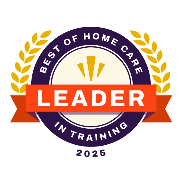 Circular badge with gold laurel leaves, a red banner reading LEADER, and the text Best of Home Care in Training 2025 in purple around the border, recognizing excellence in home care.