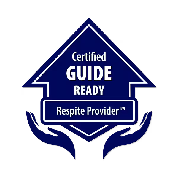 A blue badge in the shape of an upward arrow with the words Certified GUIDE READY Respite Provider™ and two stylized hands beneath, palms up—symbolizing trusted home care support.