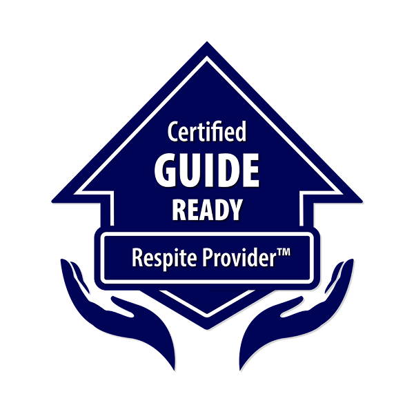 A blue badge in the shape of an upward arrow with the words Certified GUIDE READY Respite Provider™ and two stylized hands beneath, palms up—symbolizing trusted home care support.